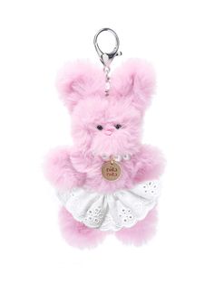 a pink teddy bear with a white dress around it's neck is hanging from a keychain