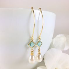 "Pearl Earrings, Gold Pearl Earrings, Pearl Dangle Earrings, Pearl Drop Earrings, Aquamarine Earrings, Aqua Pearl Earrings, Wedding Bridal Earrings, Bridesmaid Gift, Pearl Jewelry Stunning combination, these earrings are composed of a gold plated faceted aqua glass connector with a 14x8mm faux teardrop pearl dangling beneath and simply hung from long gold tone copper ear wires. Can be made in a short version if desired. Dangle length is 2-1/4\" (58mm) from the top of ear wire. Discount for multi Drop Pearl Earrings With French Hook For Wedding, French Hook Pearl Drop Earrings For Wedding, Wedding Pearl Drop Earrings With French Hook, Dangle Pearl Drop Jewelry For Bridesmaids, Dangle Earrings For Bridesmaid Gift, Bridesmaid Gift Pearl Drop Dangle Jewelry, Pearl Drop Earrings For Bridesmaid, French Hook Dangle Jewelry For Wedding, French Hook Dangle Wedding Jewelry