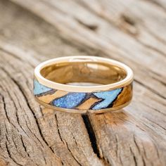 a close up of a ring on a wooden surface