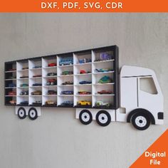 a toy truck is mounted on the wall next to a shelf with cars in it