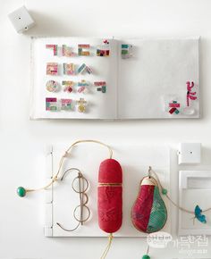 there are two pairs of red and green boxing gloves hanging on the wall next to each other