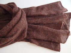 Knitted alpaca scarf of cherry-brown colour with melange effect. The yarn I used is mix of alpaca, merino wool, viscose  and polyamide, scarf is not thick and very soft. This knitted scarf is a perfect accessory for autumn, you can throw it over your shoulders or wrap it around your neck. It also can be a great gift for any occasion. Ready to ship. Measurements: 185 cm / 72.83" - long 55 cm / 21.65" - width Yarn (Italy) - alpaca, merino wool, viscose, polyamide  Made in a smoke free environment. Brown Wool Shawl Scarf, Alpaca Brown Shawl For Winter, Brown Alpaca Shawl For Winter, Brown Knitted Shawl For Fall, Brown Knitted Scarves For Fall, Winter Brown Alpaca Shawl, Brown Cashmere Shawl For Winter, Brown Alpaca Shawl For Fall, Brown Winter Shawl Wrap