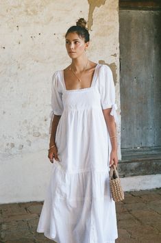 This long white cotton lace dress is one of our favorite dresses we have made so far. The white lace dress is a classic that is perfect for daytime all Spring and Summer long. The long white lace dress is made of a beautiful swiss dot cotton fabric, is fully lined, and finished with lace details. The sleeves are elbow length and are finished with a lace bow tie on each side. The dress makes you feel extra pretty, is extra flattering and is in a pretty white. Made from cotton, one of the best, natural and sustainable materials there are that makes you and your skin happy you are wearing it:). Dress is preshrunk for quality assurance. Loose, comfortable fit 100% cotton Preshrunk for ultimate quality Fully lined Cold wash, tumble dry low May dry clean, light bleach as needed Model is wearing Long White Lace Dress, White Cotton Lace Dress, White Lace Dress Long, Cotton Lace Dress, Swiss Dot Dress, Dress With Lace Trim, Parker Dress, White Cotton Dress, White Lace Dress