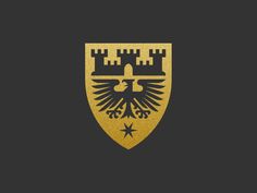 an eagle emblem on a black background with gold foil and stars in the bottom corner