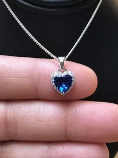 Note: Item Comes Without Chain. Specification:- Stone Details :- *Diamond Material: Cubic Zirconia (CZ)  *Center Diamond Shape : Heart Cut  *Total Diamond Weight : 1.33 CT (Approx.) *Center Diamond Measurement : 7.00 MM  *Center Diamond Weight : 1.13 CT *Side Diamond Measurement : 1.30, 1.40 MM *Side Diamond Weight : 0.20 CT *Diamond Color: White, Blue *Clarity: VVS *Making Process: Handmade by our Experienced Staff. *Stamp: Our All Pendant Stamped According to metal Purity (925 SIL/10/14/18K Gold).  Customization:- *Buyer can Request change of rhodium color in 925 Silver Jewelry (No additional Charge). *In Gold (10K, 14K, 18K) buyer can change gold color (White, Rose, Yellow). *Buyer can also change CZ Stone Color (No additional Charge). Custom Order:- *We do Accept Custom order. *Buyer c Sapphire Heart Pendant With Heart Charm, Blue Heart Pendant Clavicle Chain Jewelry, Blue Heart Cut Jewelry For Gift, Sapphire Heart Pendant Jewelry For Valentine's Day, Blue Heart-shaped Clavicle Chain Necklace, Blue Gemstone Heart Necklace For Gift, Blue Heart Shaped Clavicle Chain Necklace, Blue Heart Clavicle Chain Necklace, Sapphire Heart Pendant Necklace With Heart Charm