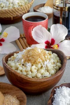 macaroni and cheese in a wooden bowl on a table next to other ingredients