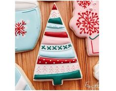 decorated christmas cookies on a wooden table