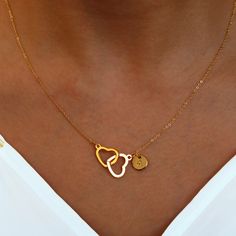 "These necklaces feature two intertwined hearts, each personalized with an initial, creating a sweet and unique piece. Crafted with care, they make the best gift choice for her, reflecting both your sentiment and her individuality. Embrace the charm of double hearts and make her feel cherished with our Double Heart Initial Necklaces, a cute and meaningful accessory that she'll treasure. #YOU MAY LIKE THIS Silver Roman Numerals Dainty Necklace https://www.etsy.com/listing/1494830562/silver-roman- Valentine's Day Initial Necklace With Heart Charm, Personalized Gift Heart Necklace With Adjustable Chain, Personalized Double Heart Jewelry Gift For Her, Heart-shaped Charm Necklace For Personalized Gift, Double Heart Initials Jewelry For Anniversary, Double Heart Initials Jewelry For Anniversary Gift, Initials Double Heart Jewelry For Anniversary, Gold Initial Necklace For Anniversary Gift, Heart-shaped Initial Necklace For Valentine's Day