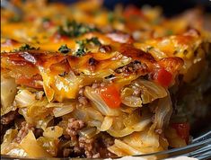 a casserole dish with meat, cheese and vegetables