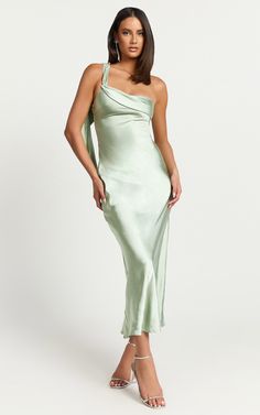 Elevate your wardrobe with the Calix Midi Dress - a stunning One Shoulder Slip Dress that enchants in a sophisticated Sage green. Crafted from luxurious satin and designed for the woman who loves to express her individuality, this dress is more than just a piece of clothing it's a statement. Product Details: Slip Dress Satin Fabric One Shoulder Formal, Party Midi Length Polyester Material Material and Care 100% Polyester Low / No stretch Pastel Green Dress, Slip Dress Satin, Basic Black Dress, Bachelorette Dress, Maxi Dresses Fall, Long Sleeve Dress Formal, Spring Capsule Wardrobe, White Long Sleeve Dress, Long White Dress