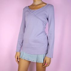 The Y2K Purple Wrap Top is a vintage 2000s dusty lilac ribbed wrap-front long-sleeve shirt with a lettuce hem. Ideal for casual autumn outfits and everyday wear. ESTIMATED SIZE M TAG SIZE L MEASUREMENTS Length 60cm - 23.62 inch Chest 96cm - 37.80 inch Our model is 172 cm tall and usually wears size XS. Please be aware that some items may be slightly pinned on the model to demonstrate the correct fit. We ship worldwide from Spain and offer free shipping on all orders when you buy 3 items or more! Y2k Tops For Spring Layering, Y2k Ribbed Tops For Spring, Purple 90s Style Tops For Fall, Purple 90s Style Top For Fall, Y2k Style Tops For Spring Layering, 90s Long Sleeve Tops For Fall, 90s Style Purple Tops For Spring, Spring Y2k Tops For Layering, Y2k Style Long Sleeve Tops For Layering