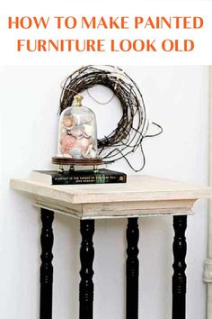 a white table with black legs and an old clock on top that says how to make painted furniture look old