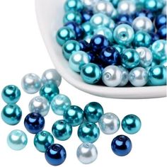 blue and white pearls in a bowl