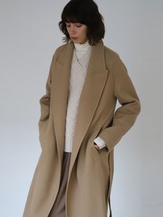 Editor's NotesThis wool twill long coat has wide and long peaked lapel collar expressing modern sophisticated look. Its simple design addressing minimalistic mood has timeless value, keep this coat in your closet for your on the go item.- Merino wool from Australia- Light and warm twill fabric- Peaked lapel collar- Contrasting under collar- Side pockets- Self fabric pockets- Back single ventMeasurements(in.)One size- Shoulder: 19.69 in.- Chest: 22.83 in. - Sleeve Length: 22.83 in.- Hem: 23.62 in.- Total Length: 46.06 in.*Model Info: Height 5' 9 / Bust 31.5 in. / Waist 23 in. / Hip 34.5 in.Composition & Care- 100% Merino Wool / Lining: 100% Polyester- Dry cleaning- No tumble dryer, no bleachDesigner- by AEER Classic Long Wool Coat In Neutral Color, Modern Structured Beige Outerwear, Classic Long Neutral Wool Coat, Modern Beige Wool Coat For Workwear, Modern Beige Wool Coat For Work, Classic Long Beige Wool Coat, Chic Single-breasted Wool Coat With Stand Collar, Brown Single-breasted Wool Coat, Wool Single-breasted Outerwear With Fold Down Collar