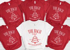 six red and white shirts with the beach club on them