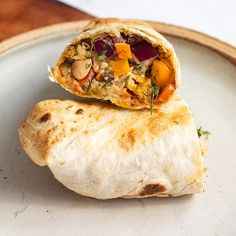 a burrito is sitting on a plate