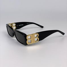 Balenciaga Bb0096s 001 Brand New Sunglasses Black Gold Rectangle Unisex Same/Next Day Shipping! Brand New And 100% Authentic! Made In Italy. Brand: Balenciaga Model: Bb0096s / Bb 0096s Color Code: 001 Gender: Unisex Frame Colour: Black With Gold Logo Frame Shape: Rectangle Frame Style: Full Rim Frame Material: Acetate Lens Color: Grey Lens Material: Plastic Uv Protection: Category 3 Size: 51x18x130 100% Uv Protection Full Retail Balenciaga Set Includes: 1. Glasses 2. Case 3. Cleaning Cloth With Designer Black Shield Sunglasses With Square Frame, Designer Black Rectangular Sunglasses, Logo Frame, Balenciaga Sunglasses, New Sunglasses, Balenciaga Black, Rectangle Frame, Gold Logo, Color Code