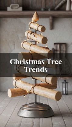 a christmas tree made out of wooden dows on top of a metal stand with text overlay