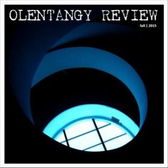 an image of the inside of a building with blue light coming from it and text that reads, olentagy review