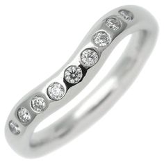 TIFFANY & Co. Elsa Peretti Platinum Diamond 3mm Curved Band Ring 4.5 Metal: Platinum Size: 4.5 Weight: 5.0 grams Width: 3mm Diamond: Nine round brilliant diamonds, carat total weight .10 Hallmarked: ©PERETTI SPAIN TIFFANY&CO. PT950 Condition: Excellent condition Tiffany Retail Price: $2,500 Authenticity guaranteed Nine Diamond Ring, Tiffany Wedding Band Tiffany & Co., Wedding Jewelry Tiffany, Elsa Peretti Jewelry Rings, Modern Wedding Rings, Open Heart Ring, Starfish Earrings, Elsa Peretti, Curved Wedding Band