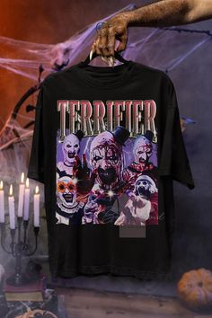 Terrifier is a 2016 American independent slasher film written and directed by Damien Leone. This film stars Jenna Kanell, Samantha Scaffidi, David Howard Thornton, and Catherine Corcoran. So this t-shirt is very suitable as a gift or for yourself to watch the film with family or friends UNISEX T SHIRT This heavy cotton tee has the classic cotton look and feel. Casual elegance will make it an instant favorite in everyone's wardrobe. .: Classic fit .: 100% Cotton (fibre content may vary for differ Horror Graphic Print T-shirt For Fans, Pre-shrunk Horror T-shirt For Streetwear, Samantha Scaffidi, Terrifier Shirt, Damien Leone, Style Movie, Slasher Film, Wardrobe Classic, Film Stars