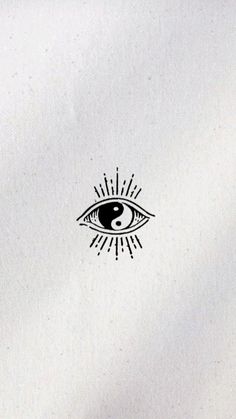 an eye with sunbursts is shown on the back of a white t - shirt