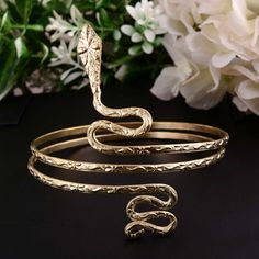 Snake Gold Bracelet, Snake Bracelet, Boho Bracelet, Adjustable Bracelet, Bangle, Arm Cuff, Serpent Bangle METAL :- Brass ❥ Customers satisfaction is our biggest priority, please contact us with any questions/queries for future or existing orders, and we will do our best to make sure you are happy with your order. ♥ Please Make Sure to Include The Correct Address During Before Order. You Can return Item within 30 Days After Successful Delivery. We Offer 100% Money Back Guarantee If You Not Satisf Adjustable Brass Bracelets For Party, Adjustable Snake-shaped Metal Jewelry, Adjustable Snake Shaped Metal Jewelry, Snake-shaped Metal Bracelets As Gifts, Adjustable Snake Bangle Gift, Adjustable Snake-shaped Bangle For Gifts, Adjustable Snake Bangle For Gift, Gold Bangle Wrap Bracelet For Festival, Resizable Bangle Jewelry For Festivals