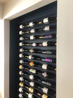 a wine rack with many bottles on it