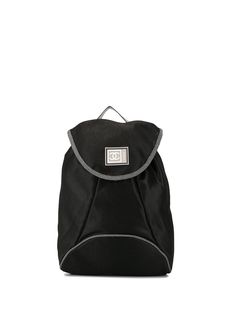 A distinct match to elevate your nonchalant sport style. In the same line as the eye-catching chunky sneakers if this Chanel logo printed backpack from the Sports Line, in jet black and white contrasting straps. Upgrade your game. Featuring silver-tone hardware, an internal logo patch, a front logo patch, a foldover top with magnetic closure, a full lining, a mesh construction, an elasticated drawstring closure and logo printed adjustable shoulder straps and top handle. Please be mindful that th Sporty Logo Bags For Streetwear, Sporty Black Standard Backpack, Sporty Black Backpack, Black Sports Backpack, Sporty Black Backpack For Travel, Sporty Black Backpack For Outdoor Activities, Sporty Black Backpack For Outdoor, Sporty Black Outdoor Backpack, Black Sporty Backpack For Everyday Use