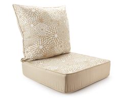 an outdoor chair cushion with a flower pattern on the front and back, made out of beige fabric