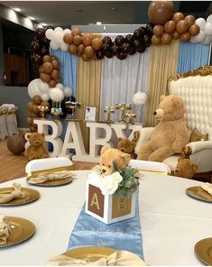 a baby shower party with teddy bears and balloons