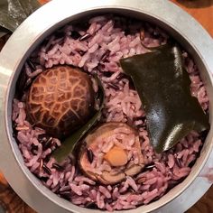 the food in the bowl is prepared and ready to be eaten by the people at the table