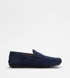 City Gommino driving shoes in rich suede with exposed stitching, penny bar, stamped Tod's monogram and an iconic solid rubber outsole with embossed rubber pebbles. Classic Blue Moccasins With Suede Lining, Classic Blue Moccasins With Stitched Sole, Luxury Blue Suede Moccasins, Blue City, Driving Shoes, Suede Shoes, Penny, Dust Bag, Loafers