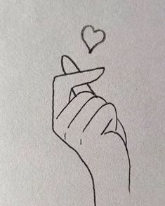 a drawing of a hand holding a heart