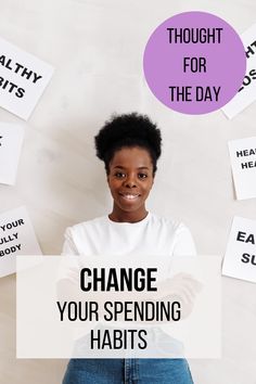 a woman holding a sign that says, thought for the day change your spending habitts