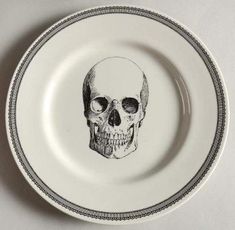 a plate with a drawing of a skull on it