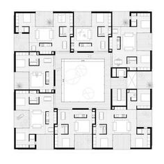 the floor plan for an apartment building with multiple rooms and two floors, all in black and white