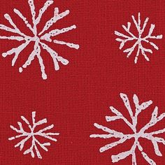 three snowflakes on a red background