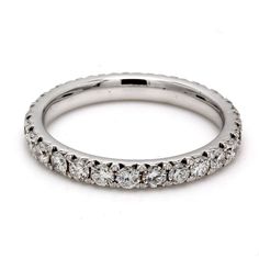 a white gold wedding band with round diamonds