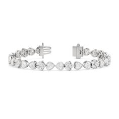 A tennis bracelet with a floral motif, perfect for the romantic at heart. Showcasing a pattern of tulips, it features a combination of marquise and princess-cut diamonds on elegant V-prongs, and bezel-set heart-shaped diamonds. With a touch of nature's beauty, this diamond bracelet is bound to give your looks a dreamy and modernly feminine finish. Classic Marquise Cubic Zirconia Tennis Bracelet, Elegant White Marquise Bracelets, Classic Pear-shaped Diamond Tennis Bracelet, Elegant Heart Cut Tennis Bracelet For Weddings, Elegant Marquise Tennis Bracelet For Anniversary, Elegant Wedding Tennis Bracelet With Heart Cut, Pear-shaped Diamond Accented Bracelets For Anniversary, Marquise Brilliant Cut Tennis Bracelet For Wedding, Elegant Heart Cut Diamond Bracelet