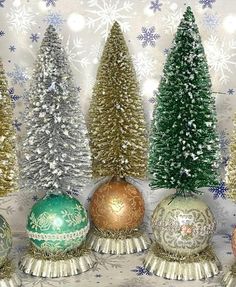 there are many different types of christmas trees in this group, all decorated with gold and green ornaments