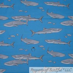 a blue background with sharks and fish on it