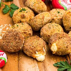 several crab cakes on a cutting board with peppermint leaves and candy in the background