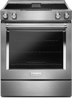 a stainless steel oven with the door open and two burners on it's side