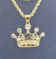 A beautiful crown for the princess that turns 15, all in 14k gold  With a 20 inch and 2mm thick, rope style necklace in 14k gold for just $529.00!  Pendant is 15mm in height and 20mm width, with zirconia synthetic  stones. Gift box is included.  Una hermosa corona para la princesa que cumpla sus 15 años en oro de 14k  Con una cadena estilos torzal de 20 pulgadas y 2mm de gruesa, en oro de 14k por tan solo $529.00.! El pendiente esta 15mm de alto y 20mm de ancho, con piedras zirconia sinteticas . Caja de regalo incluida. Catholic Jewelry, Necklace Lengths, Jewelry Necklace Pendant, Handmade Items, Jewelry Necklaces, White Gold, Pendant Necklace, Gemstones, Pendant