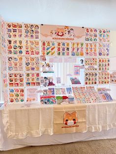 the table is covered with many different pictures and stickers on it's walls