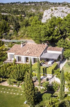 an aerial view of a house surrounded by trees