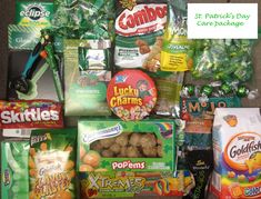 an assortment of snacks and candy are displayed