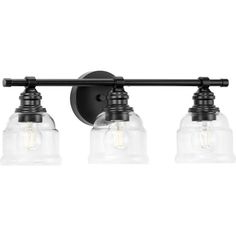 three light bathroom vanity fixture with clear glass shades and black metal finish on the wall