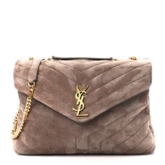 This is an authentic SAINT LAURENT Suede Y Quilted Monogram Medium Loulou Chain Satchel in Taupe. This elegant shoulder bag is crafted of brown chevron-quilted suede. The bag features an aged gold chain-link shoulder strap with matching shoulder pads. The front flap has a prominent gold YSL monogram detail and opens to a partitioned fabric interior with zipper and patch pockets. Baby Monogram, Dark Beige, Saint Laurent Bag, Wallet Chain, Fall 2024, Shoulder Pads, Chain Link, Gold Chain, Patch Pocket